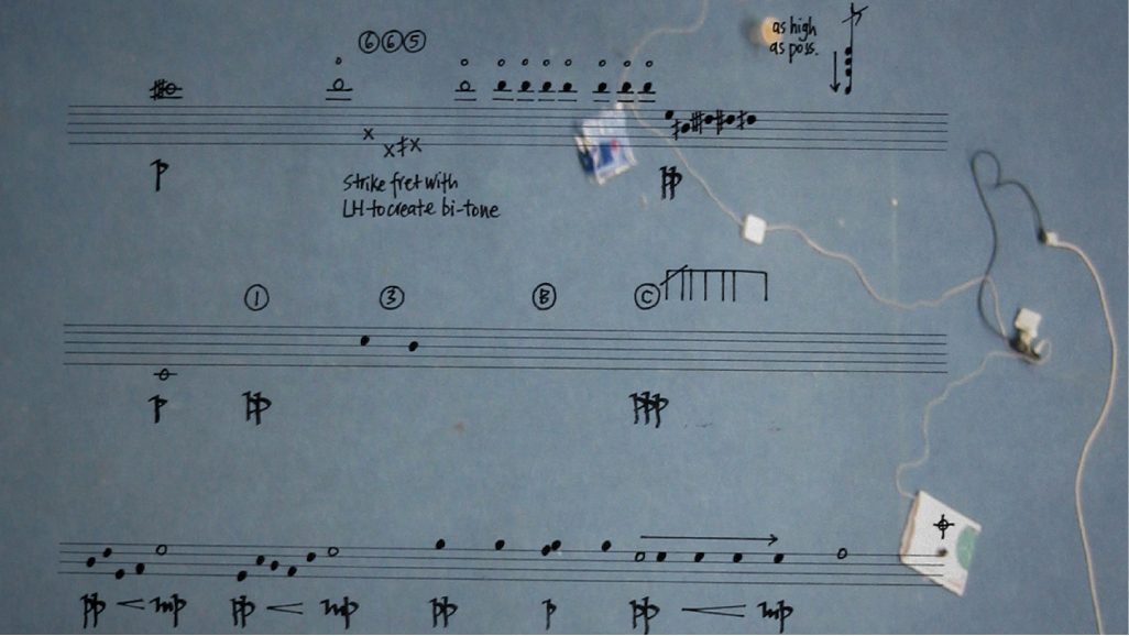 Score page from Scale — handwritten music notation with objects